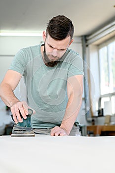 Young worker in a carpenters workshop