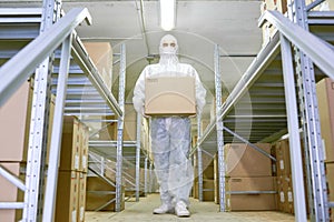 Young Worker Carrying Cardboard Box