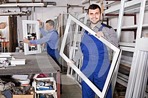 Young worker is demonstrating PVC manufacturing output