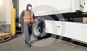 Young worker at express courier with Coronavirus protection mask