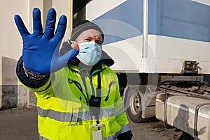 Young worker at express courier with Coronavirus protection mask