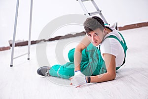 The young worker falling from the ladder