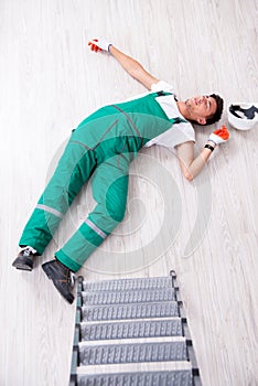The young worker falling from the ladder