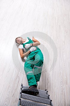 The young worker falling from the ladder