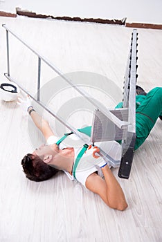 The young worker falling from the ladder