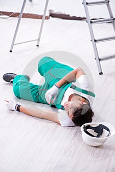 The young worker falling from the ladder