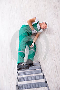 The young worker falling from the ladder