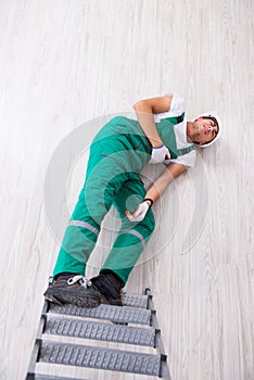 The young worker falling from the ladder