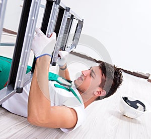 Young worker falling from the ladder