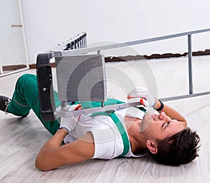 Young worker falling from the ladder