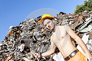 Young worker in a junkyard