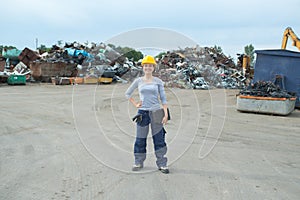 Young worker in junkyard