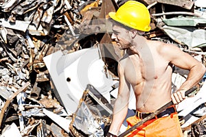 Young worker in a junkyard