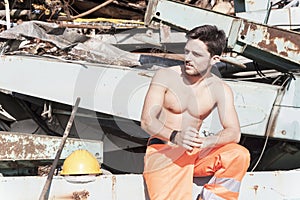 Young worker in a junkyard