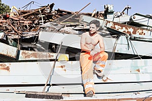 Young worker in a junkyard