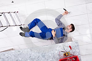 Young Worker Lying On Floor