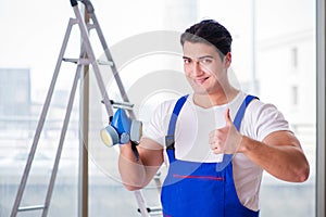 The young worker with protective face gas mask