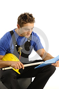 Young worker reading instructions