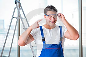 The young worker with safety goggles