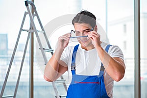 The young worker with safety goggles