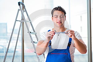 The young worker with safety goggles