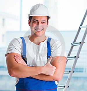 Young worker with safety helmet hardhat