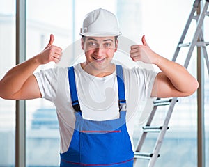 Young worker with safety helmet hardhat