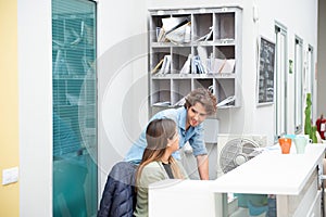 Young workers at the reception of their offices