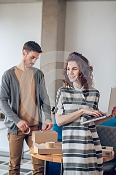 Young workers working in the Internet store office