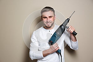 Young working man with rotary hammer