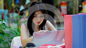 Young working woman working outside the office