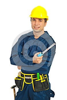 Young workman holding ruler
