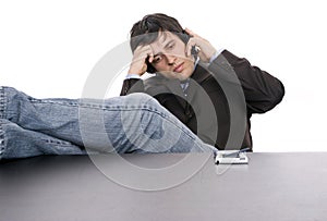 Young worried businessman on the phone