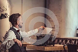 Young writer with a retro typewriter