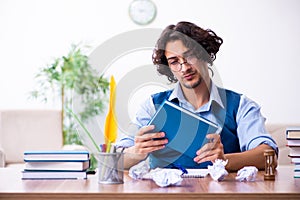 Young writer working on his new work