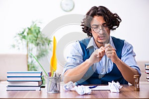 Young writer working on his new work