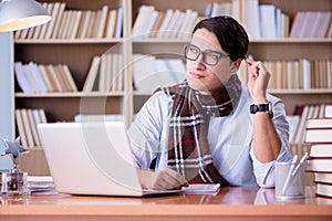 The young writer working in the library