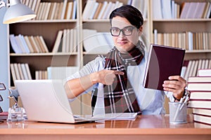 The young writer working in the library