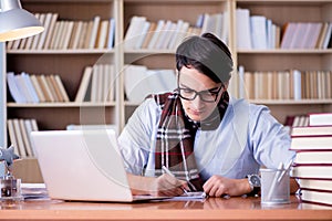 The young writer working in the library