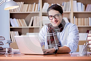 The young writer working in the library