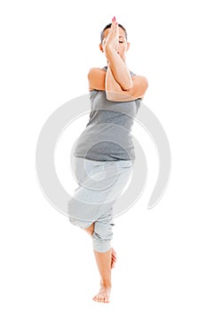 Young yoga female doing yogatic exercise photo