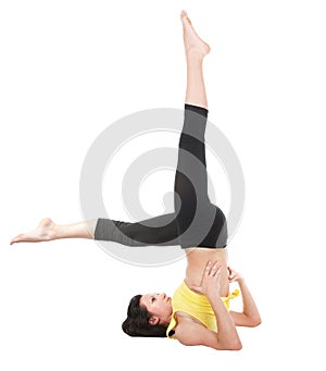 Young yoga female doing yogatic exericise