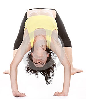 Young yoga female doing yogatic exericise