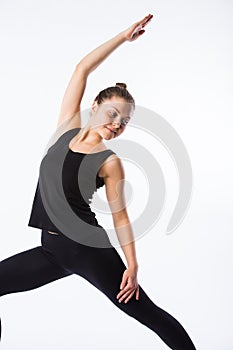 Young yoga woman warrior pose. This is part of a series of various yoga poses by this model, on white