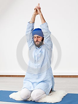 Young yogi man doing extension photo