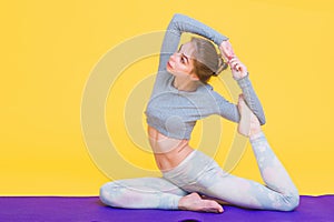 Young yogini woman stretching