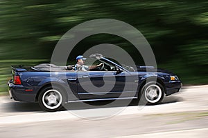 Younging Man Speeding in Convertible