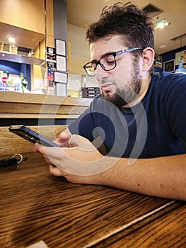 Youngman typing a message on the phone