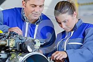 Youong female apprentice mechanical engine
