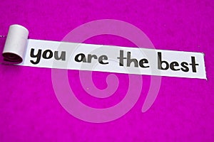 Your Are the Best text, Inspiration, Motivation and business concept on purple torn paper